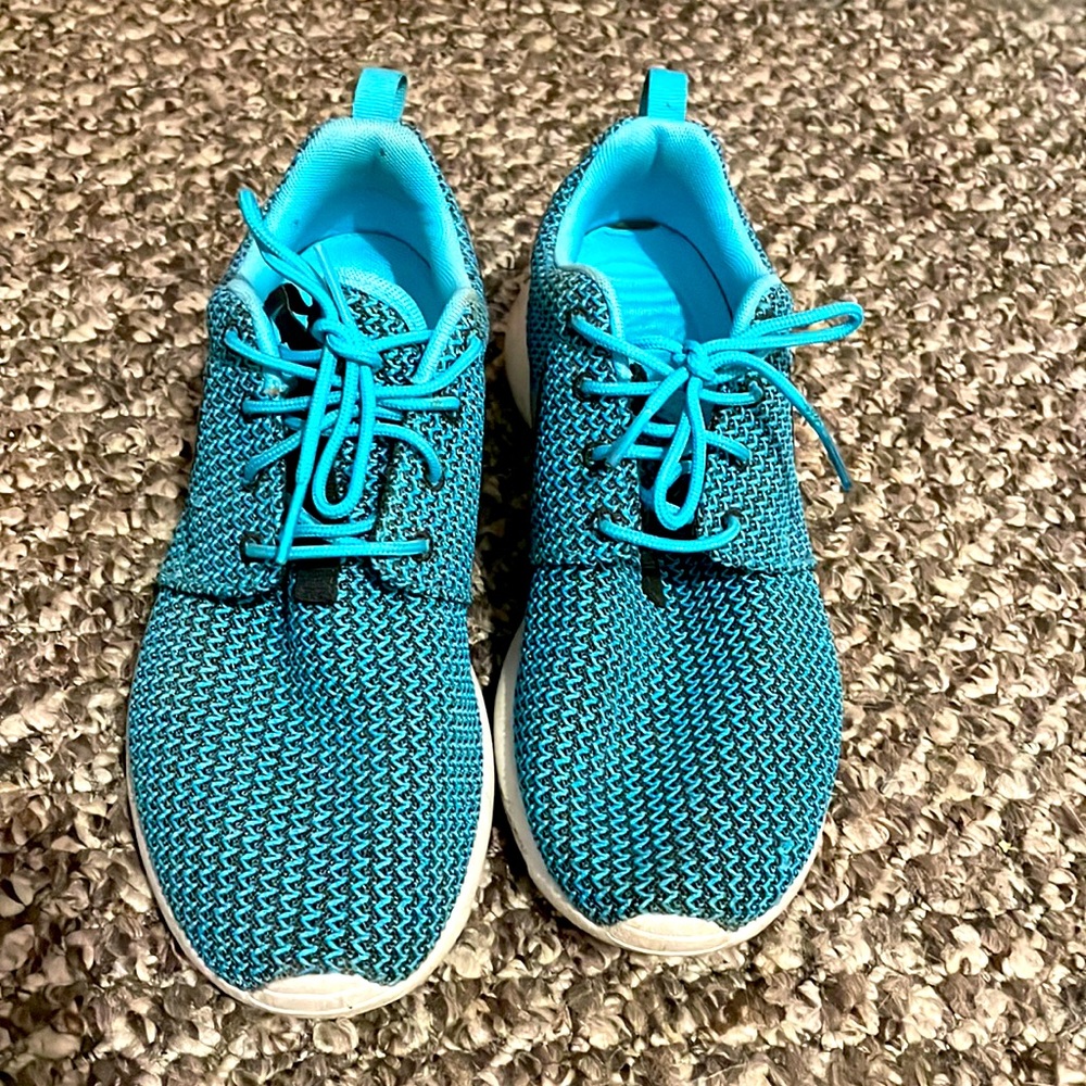 Turquoise Nike running shoes